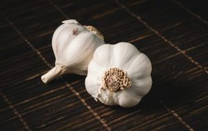 Two White Garlics by Isabella Mendes